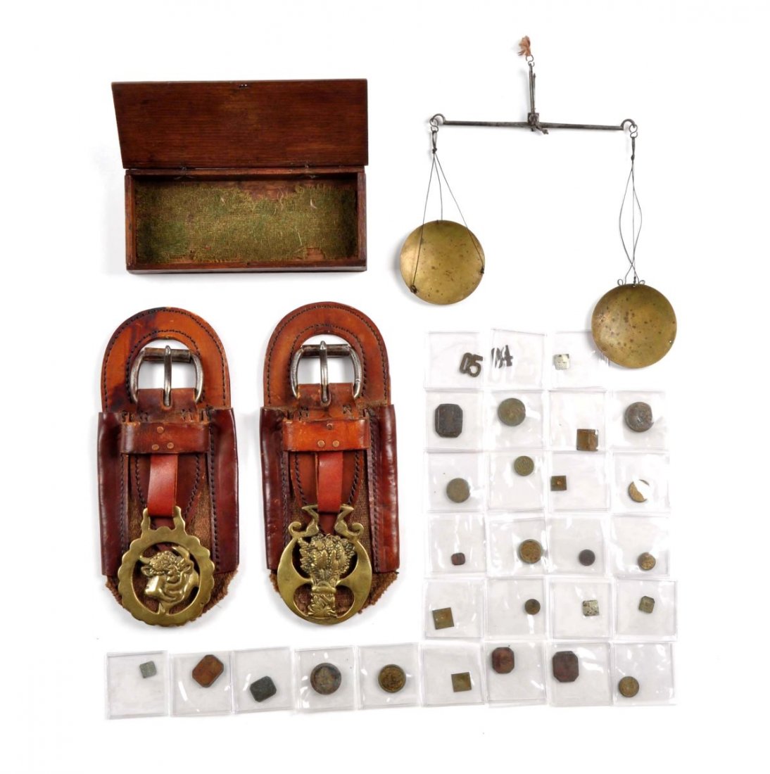Old West Memorabilia Lot.: To include: Two highly decorative heavy leather saddle decorations with early roller buckle, each has a solid brass die cut medallion, the brass measures 4” x 3” total length measuring 10”, the 
