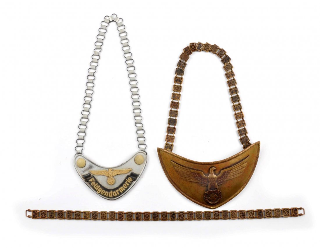 Two German Gorgets.: The larger emblem of the two measures 4-1/2" deep 10" wide, brass needs good cleaning, felt lining, each hanger has German Swatzika Eagle, also comes with an additional matching hanger. The small tin