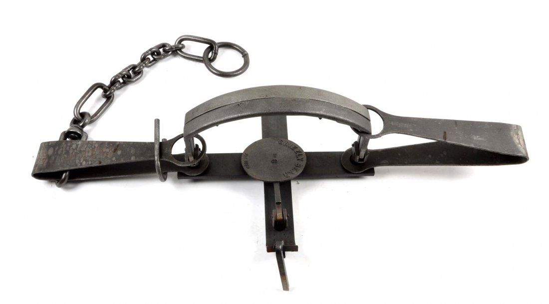 Cast Iron Grizzly Bear Trap.: Patented 1859. With staking chain. Jaws measure 6" in length. Contemporary manufacture. Condition (Excellent). Size 43 - 1/2" L.