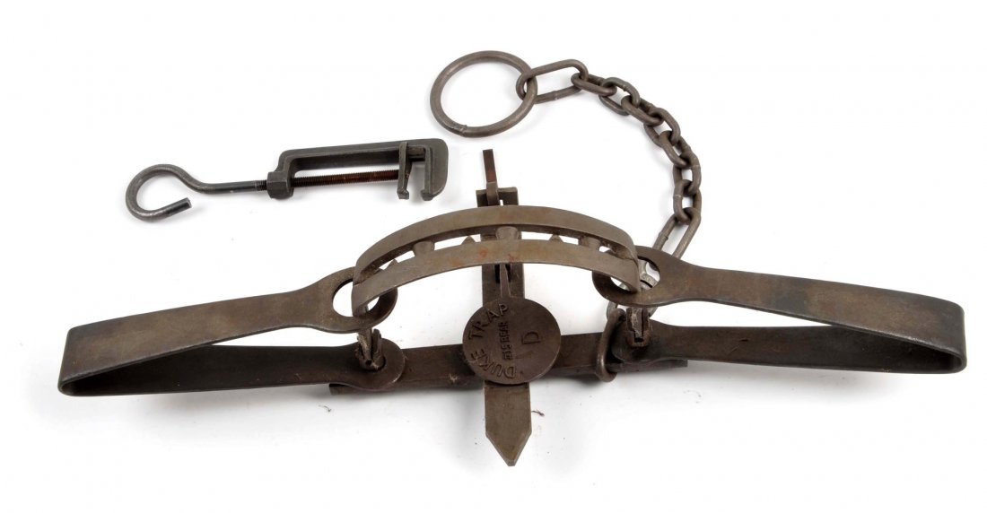 Duke Trap No. 15 Bear.: Cast iron with original staking chain. Jaws measures 11"in length. Contemporary manufacture. Condition (Excellent). Size 34 - 1/2" L.