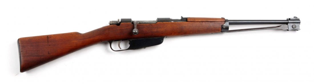 (C) Italian Model 1938 Cavalry Carbine.: Serial # Y1747 Caliber 6.5mm with a 17.75" barrel. Standard military World War II issue that features the fixed rear sight. Stamped "Cal. 6.5". Manufactured in Gardone. Has the attached folding bayone