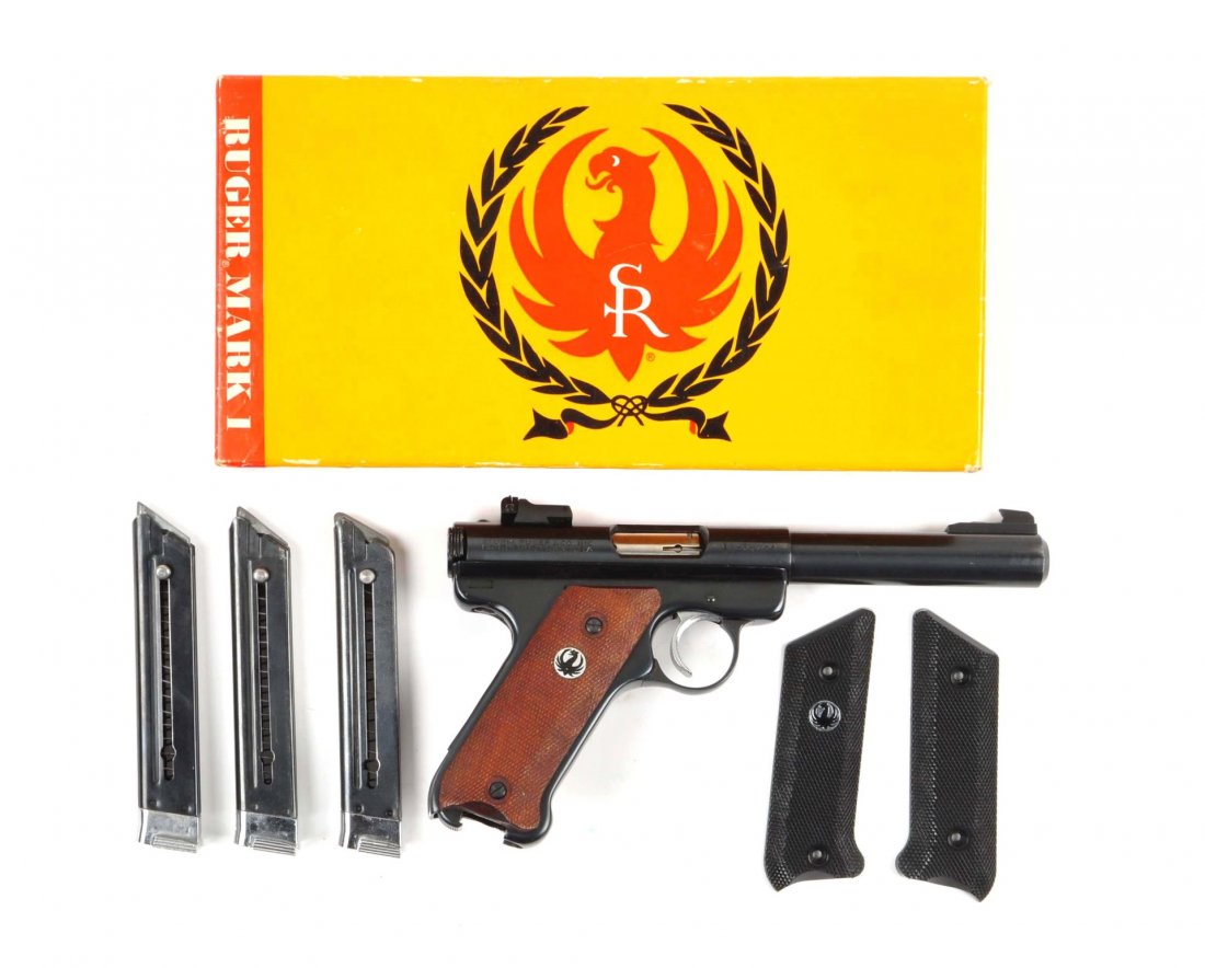 (M) Boxed Ruger Mark I Semi Automatic Pistol.: Serial # 11-50244 Caliber .22 long rifle, Barrel length 5-1/2". Offered is an excellent example of the heavy barrel semi auto Ruger target pistol. With heavy barrel, adjustable rear sight, blued finis