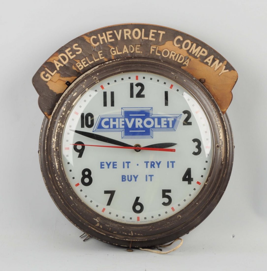 Rare Chevrolet "Eye It - Try It - Buy It" Clock.: “Eye It - Try It - Buy It” clock. "Glade Chevrolet Company, Belle Glade, Florida. Clock is original. Extremely hard clock to find. Has a milk glass face, lights up and works well. The bezel has so