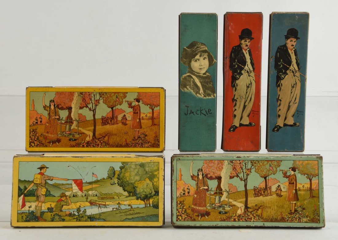 Lot Of 6: Pencil Holder Tins.: Included are two Charlie Chaplin, a Jackie and three other Wallace pencil tins. Condition (Good - Very Good). Size Largest : 7 -3/4" L.
