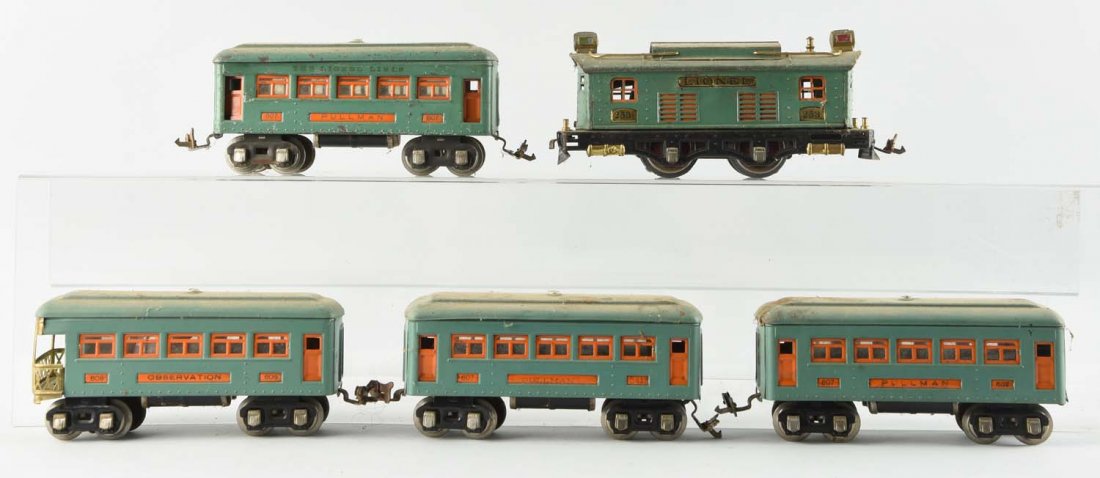 Lot Of 5: Lionel No. 253 and Passenger Cars.: No. 253 Locomotive, needs to be re-geared, broken coupler and missing a pantograph. Three No. 607 Pullman Cars and No. 608 Observation Car, scratches and paint chips throughout.