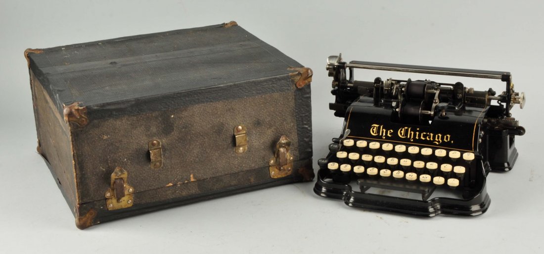 The Chicago 1900 Typewriter.: Original dust cover, operational. Size 13" x 14" x 7".