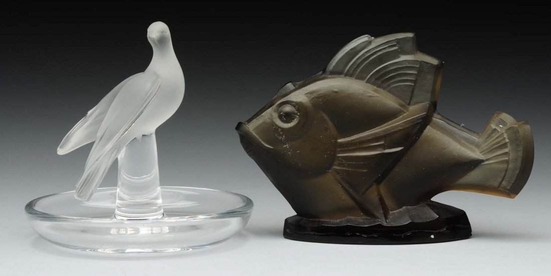 Lot Of 2: Art Glass Pieces.: Lalique ashtray with a bird finial, 4" tall. Sabino glass fish, 5" long with a chip to the dorsal fin. Condition (Very Good - Excellent). Size Largest: 4-3/4'' L.