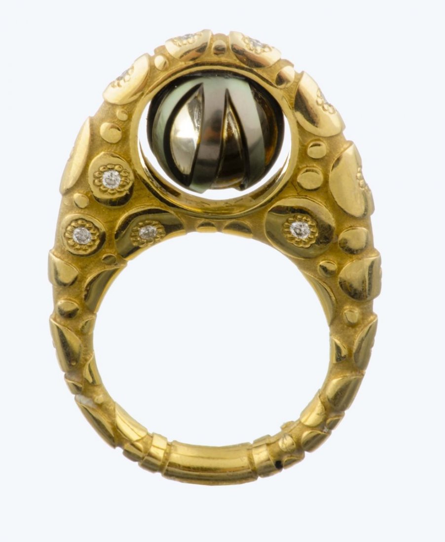 A Pearl, Gemstone And Diamond Ring, Galatea.: Carved cultured Tahitian pearl revealing a citrine nucleus with full cut diamond accents; mounted in a tall flat detailed eighteen karat gold setting. Ring size: 5 1/2; Gross weight: 5.66 dwt. All ite