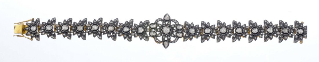 A Mughal Style Diamond Bracelet.: Set with table cut diamonds; set in silver. L: 7 1/2 in.; Gross weight: 25.98 dwt.
