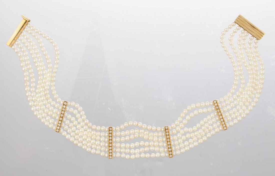 A Multi Strand Pearl Choker Necklace.: With six strands of cultured pearls measuring approximately 4.0mm; with four full cut diamond spacers; total diamond weight approximately 1.20 carats. L: 12 in.
