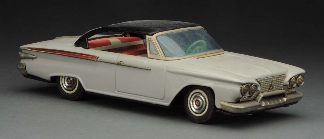Japanese Tin Friction Plymouth Two Door Sedan. (1 of 3)