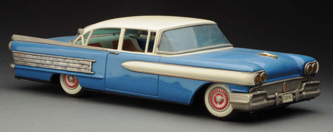 Japanese Tin Litho Friction 1958 Oldsmobile Sedan. (1 of 3)