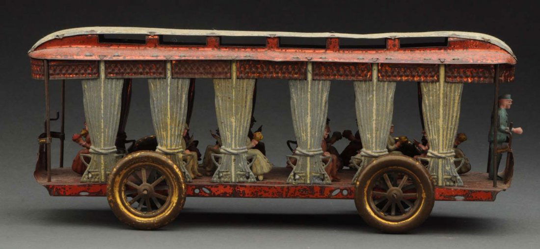 Early French Street Trolley Pulltoy.: Often times French toys are overlooked when compared to German toys such as Marklin or Bing. That should not be the case especially when viewing this toy! An open sided trolley with simulated drawn cu