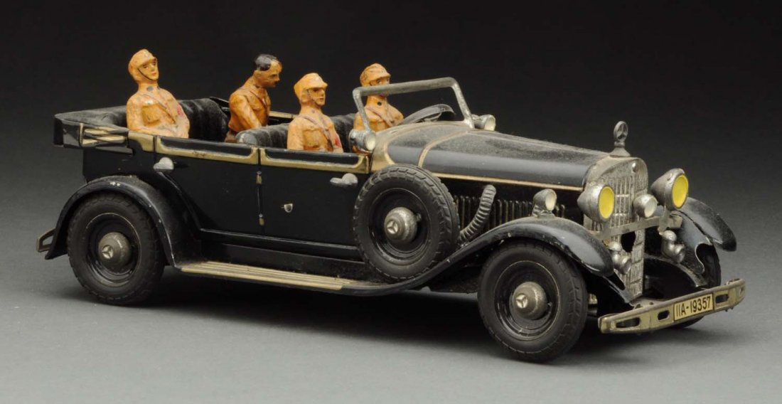German Tippco Hitler Mercedes Car.: Circa 1936. Tin litho wind-up car which contains four Elastolin figures including Adolf Hitler in rear. Some minor chipping and wear to figures. Two original side mount tires. Looks to be original lig