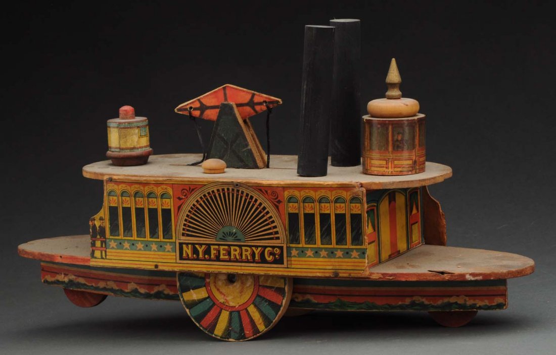 Reed N. Y. Ferry Co. Paper on Wood Boat.: Attributed to the W.S. Reed Toy Company this is a toy simulating the type of ferry that was utilized between Staten Island and lower Manhattan along with several other large metropolitan cities. Nicel
