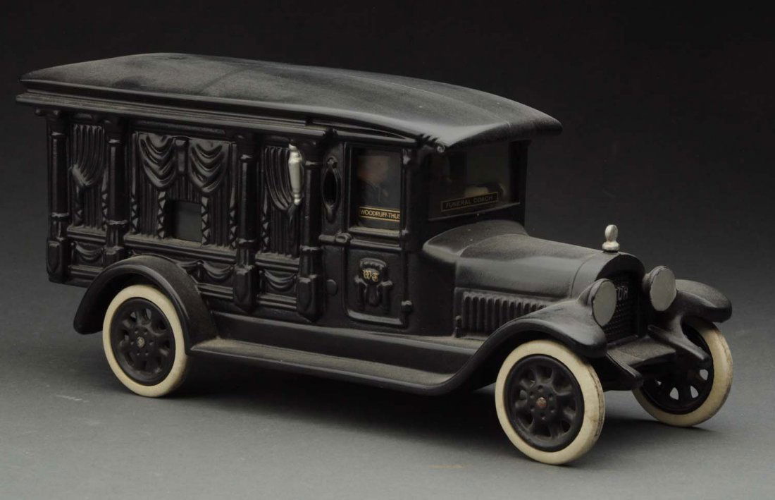 Contemporary Cast Iron Hearse Toy.: Made by Motorcade Products. Produced late 1970's in limited numbers. White rubber tires and twin drivers. Modeled after a 1920 Meteor Hearse. Opening back doors. Condition (Near Mint). Size 10 -1/4" L