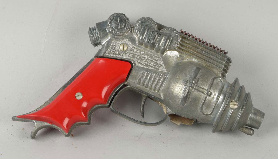 Hubley Diecast Buck Rogers Disintegrator Gun.: Has original price tag from the store. Grips are nice with no cracking. Some general wear to silver. Condition (Very Good - Excellent). Size 7'' L.
