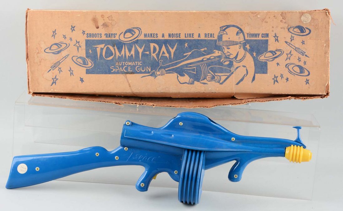 Molded Plastic 1950's Tommy-Ray Space Gun.: Includes original box showing child in helmet using the ray gun. Made by B-W Molded Plastics, California. Circa 1953. Embossed "Space" on both sides above the trigger. Front and rear sight. Battery op