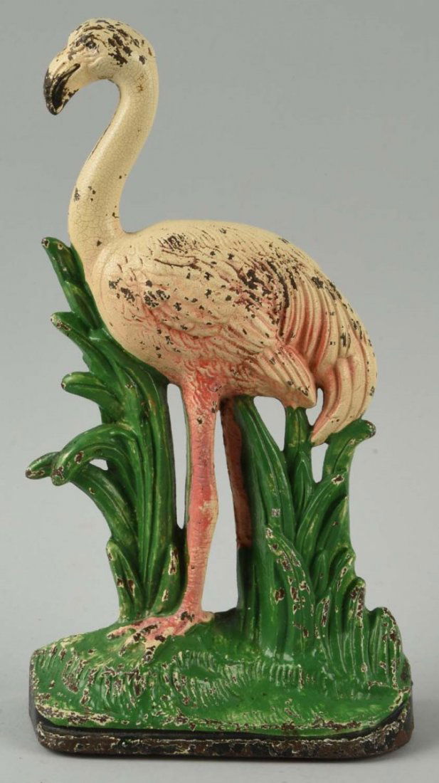 Cast Iron Flamingo Doorstop.: Hubley, cat. No. 450. Full-figure with realistic depiction of a flamingo standing amongst reeds. Elegant form, vivid colors. One of the rarer forms of doorstops produced by Hubley. Book example. Condi