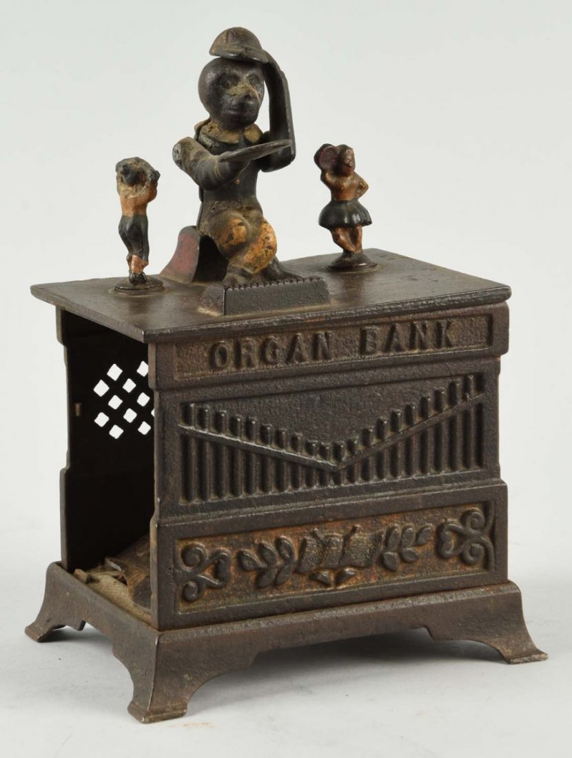 Kyser Rex Organ Still Bank.: With boy and girl. Missing crank, back and one side panel is broken. Missing the trap. (JY). Condition (Good). Size 7-1/2'' T.