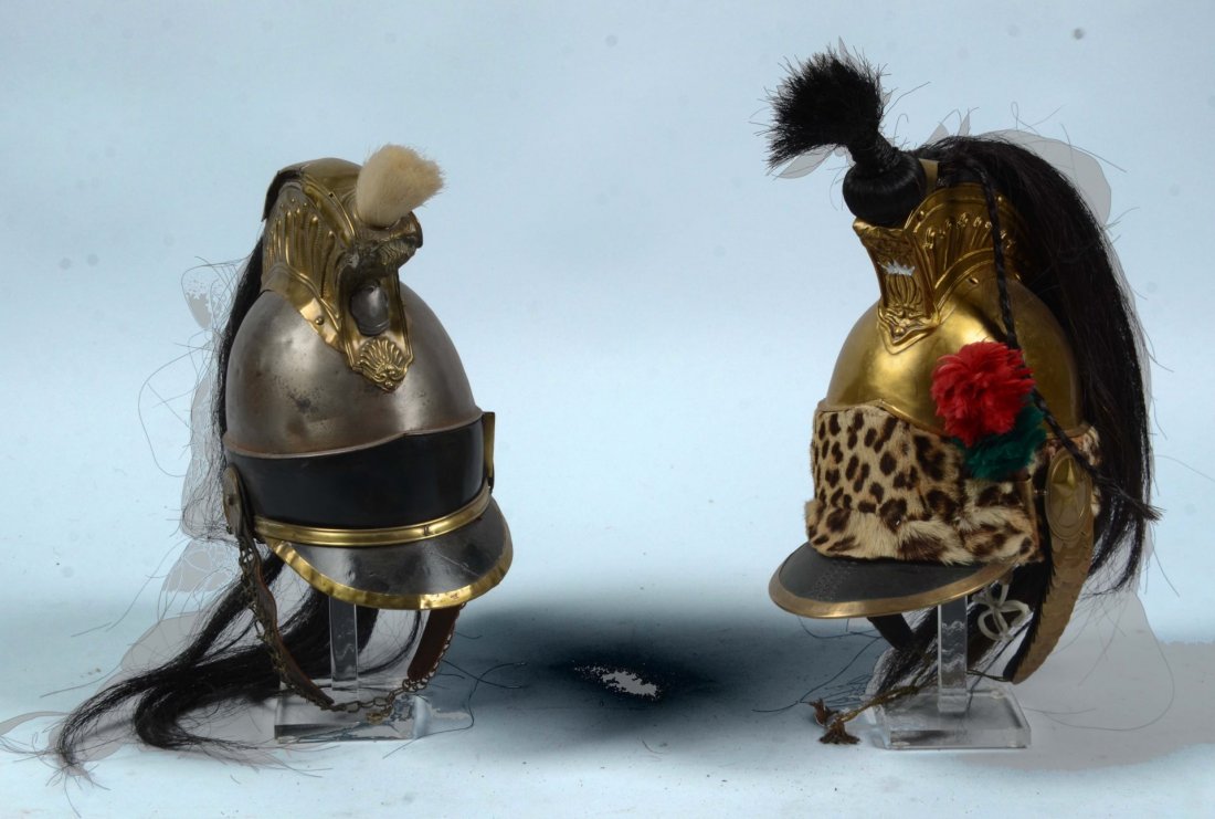 Reproduction Cuirassier & Original Cuirassier: 1) Reproduction cuirassier. Bronze color with leopard skin with plume. Faux horse hair, brass scale chin strap, star rosette. Lining with sweat band. Shows small dents but in very good shape; 1) Cuira
