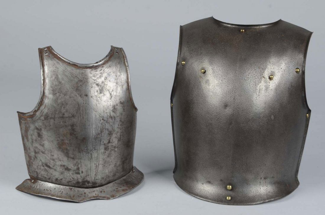 Lot of 2: Breastplates.: Comprised of: 1) Very thick breastplate with a floating fauld that is attached by a rivet on either side. Through the light oxidation and small dents, an original design of lines and a cross are prese