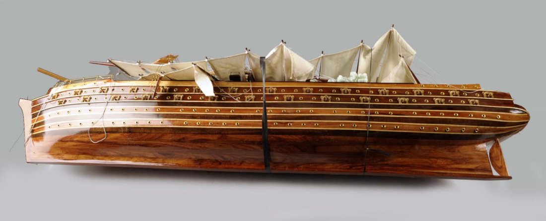 Model Ship of The Napoleon.: This is a model of the Napoleon, which was a 90 gun ship of the line of the French Navy that launched in 1850. Its masts, sails, and rigging were taken down for shipping and remain that way. An instru