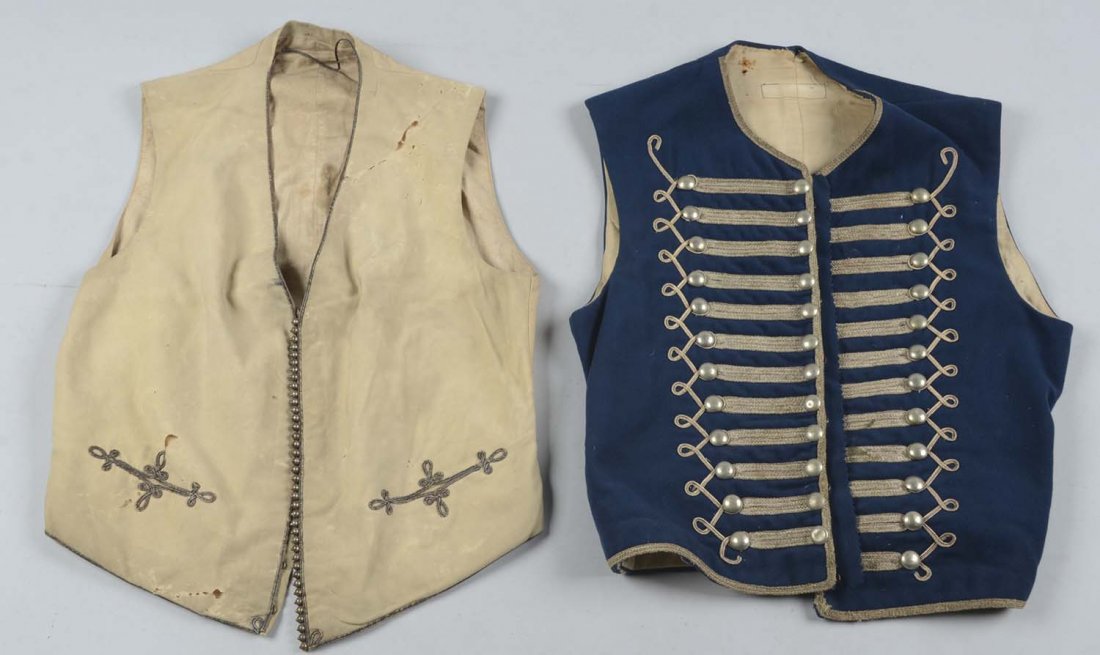 Lot of: 2: Officer’s Waistcoats.: Comprised of: 1) Unknown white wool waistcoat with bullion edging, two front pockets with bullion trim and white lining. 2) Officer’s blue wool waistcoat with bullion wire, trim and three rows of si