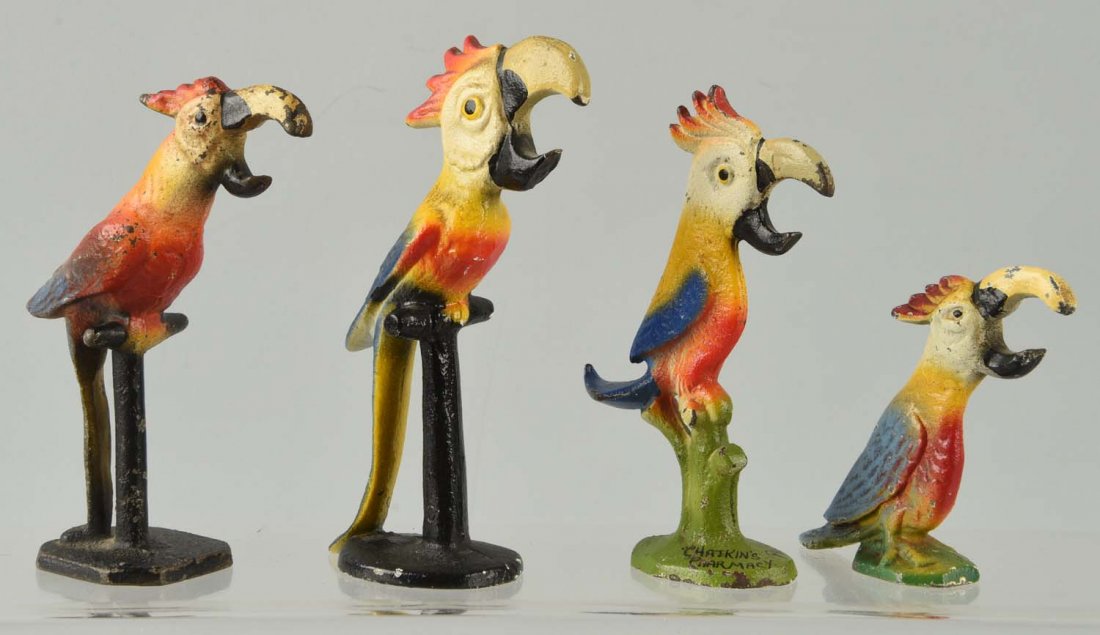 Lot of 4: Cast Iron Assorted Parrot Bottle Openers: One is a combination can opener and bottle opener. Condition (Very Good). Size Largest: 5-1/2'' L.