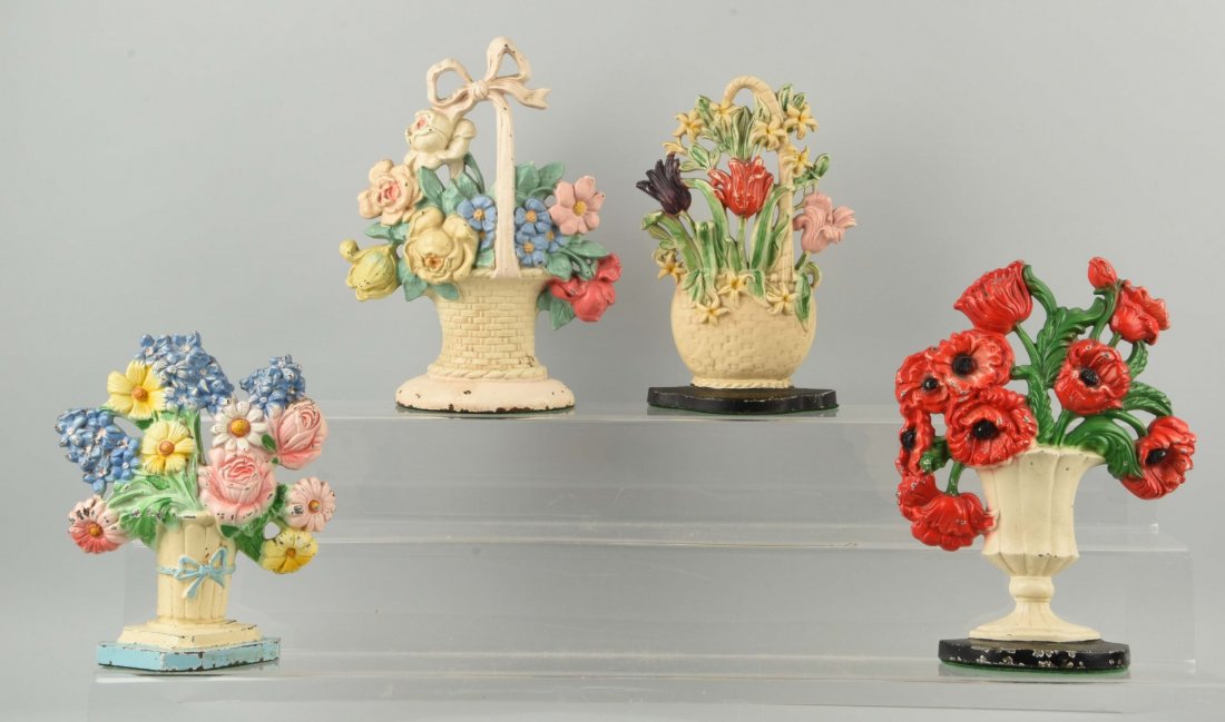 Lot of 4: Cast Iron Assorted Flower Doorstops. (1 of 1)