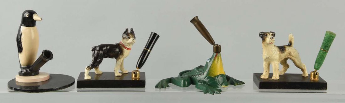 Lot of 4: Cast Iron Assorted Ink Pen Holders. (1 of 1)