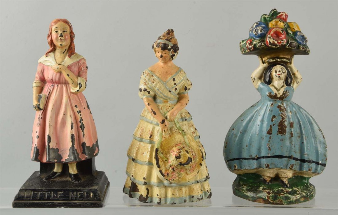Lot of 3: Cast Iron Assorted Lady Doorstops. (1 of 1)