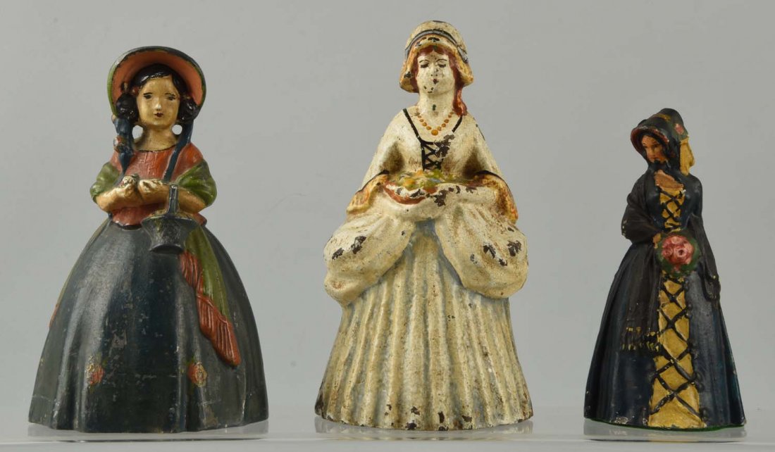 Lot of 3: Cast Iron Assorted Lady Doorstops. (1 of 1)