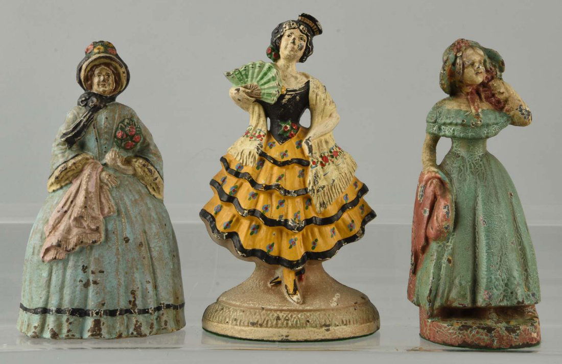 Lot of 3: Cast Iron Assorted Lady Doorstops. (1 of 1)