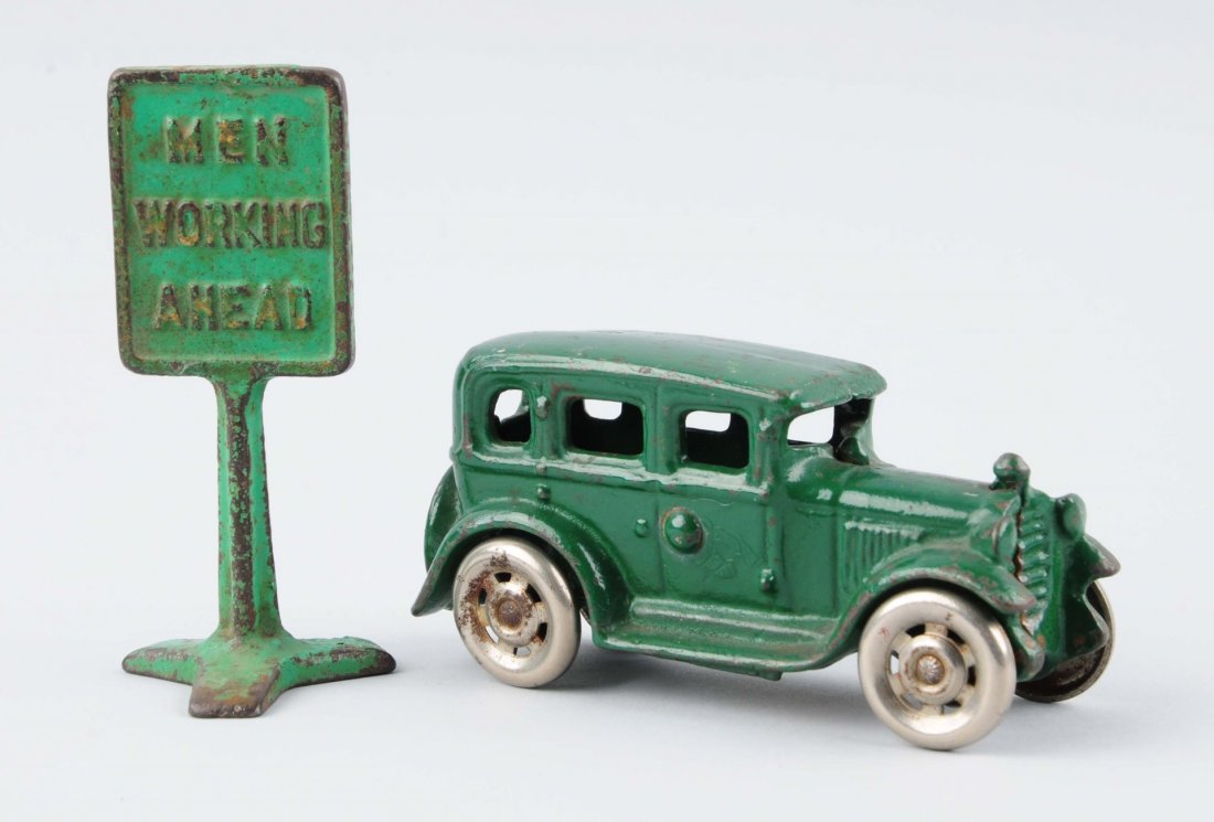 Lot of 2: Green Cast Iron Car & Sign. (1 of 2)