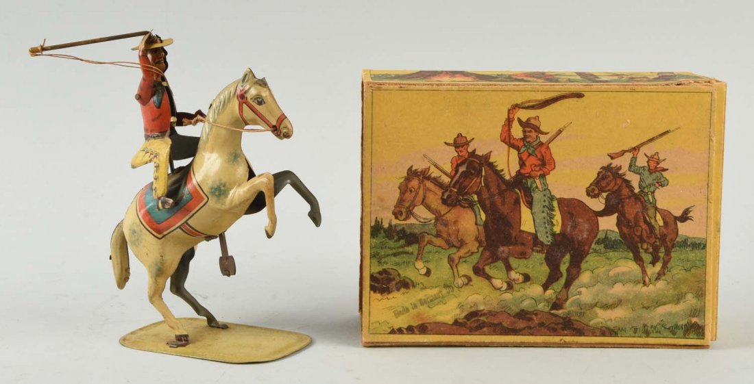 Lot of 2:German Tin Wind Up Horse w/ Rider Toys.: Both in original boxes. One is made by George Kohler and is a man riding a horse. Marked "Made in U.S. Zone Germany" on the horse's stomach. The second is a cowboy riding a rearing horse. Box is very 