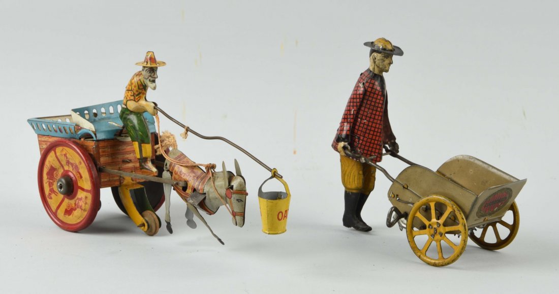 Lot Of 2: Girard & Ferdinand Strauss Tin Toys.: Ferdinand Strauss, Jenny the Balking Mule toy, legs are bent, otherwise the toy is clean and in very good condition. Girard, Man Pushing Wheelbarrow - needs his arm repaired, some scratches and paint 