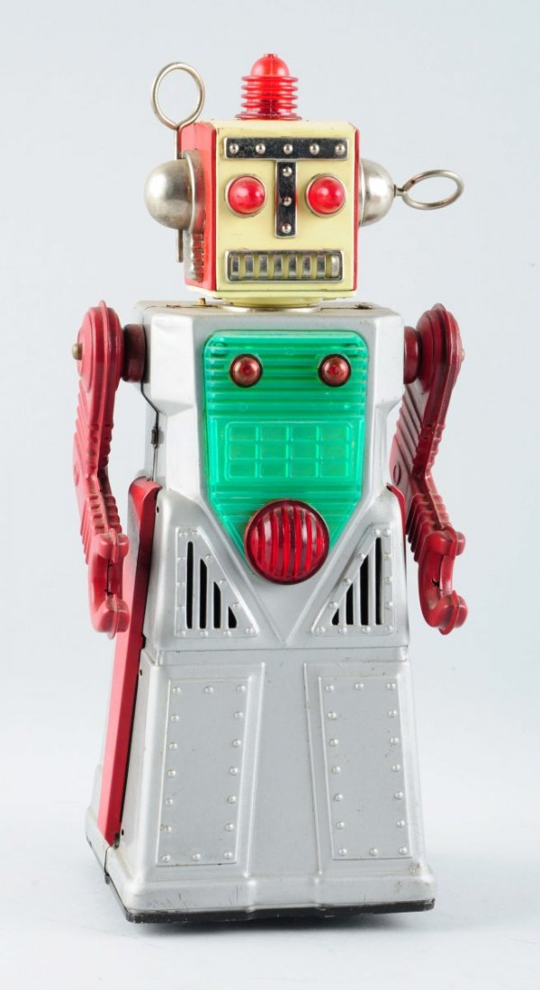 Japanese Tin Battery Op Radical Robot.: Complete, combination of metal and plastic. Does have some spidering to litho on the sides with general scratching and wear. Condition (Very Good). Size 11 - 1/2" T.
