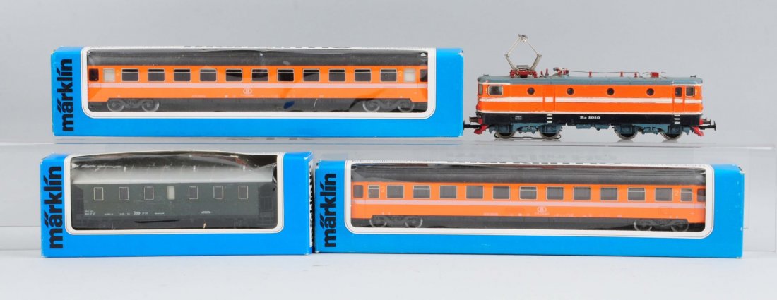Lot of 4: Marklin Locomotive & Passenger Cars.: Consists of: Orange with white strip, Electric Outline Locomotive - missing a pantograph, some scratches and paint chips, in good condition. No. 4166 Passenger Car - orange, complete and all original,