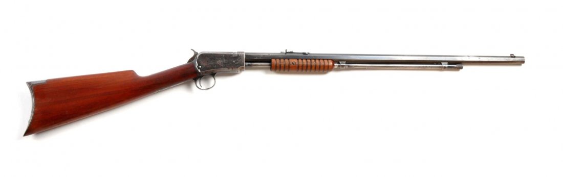 (C) Winchester Model 1890 Slide Action Rifle.: Serial # 363311 24" barrel in .22 short caliber. Manufactured in 1908. Features: full octagon barrel, sporting sights, two thirds magazine loading tube, take down, blue finish, grooved walnut forend, 