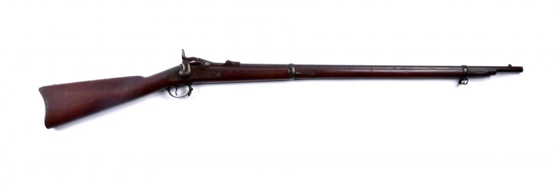 (A) U.S. Springfield Model 1873 Trapdoor Rifle.: Serial # 269138 32-5/8" barrel in .45-70 govt. This trapdoor rifle remains in excellent all original condition. Barrel retains approximately 90% of the blue-brown patina. Rear sight missing, as is ram