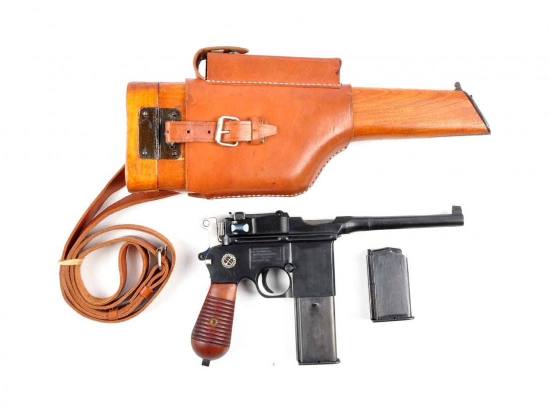 (C) Chinese Broomhandle Model C-96 Removable Mag.: Serial # 13334 5" barrel in 9mm caliber. This is an early Chinese version of the Mauser Broomhandle Model C-96. Resembles any standard C-96 Model. Features the blued finish with the long range rear ta