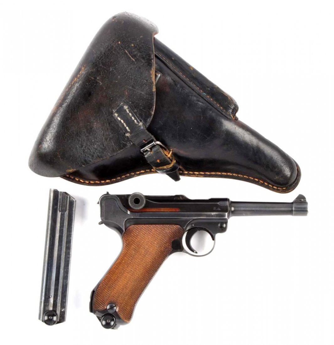 (C) 1934 Code byf Luger & Capture Papers.: Serial # 8630 4" barrel in 9mm caliber. Manufactured by Mauser for the German military, byf was assigned to Mauser. This is stamped 42 above chamber. Standard configuration, blued finish and checkered