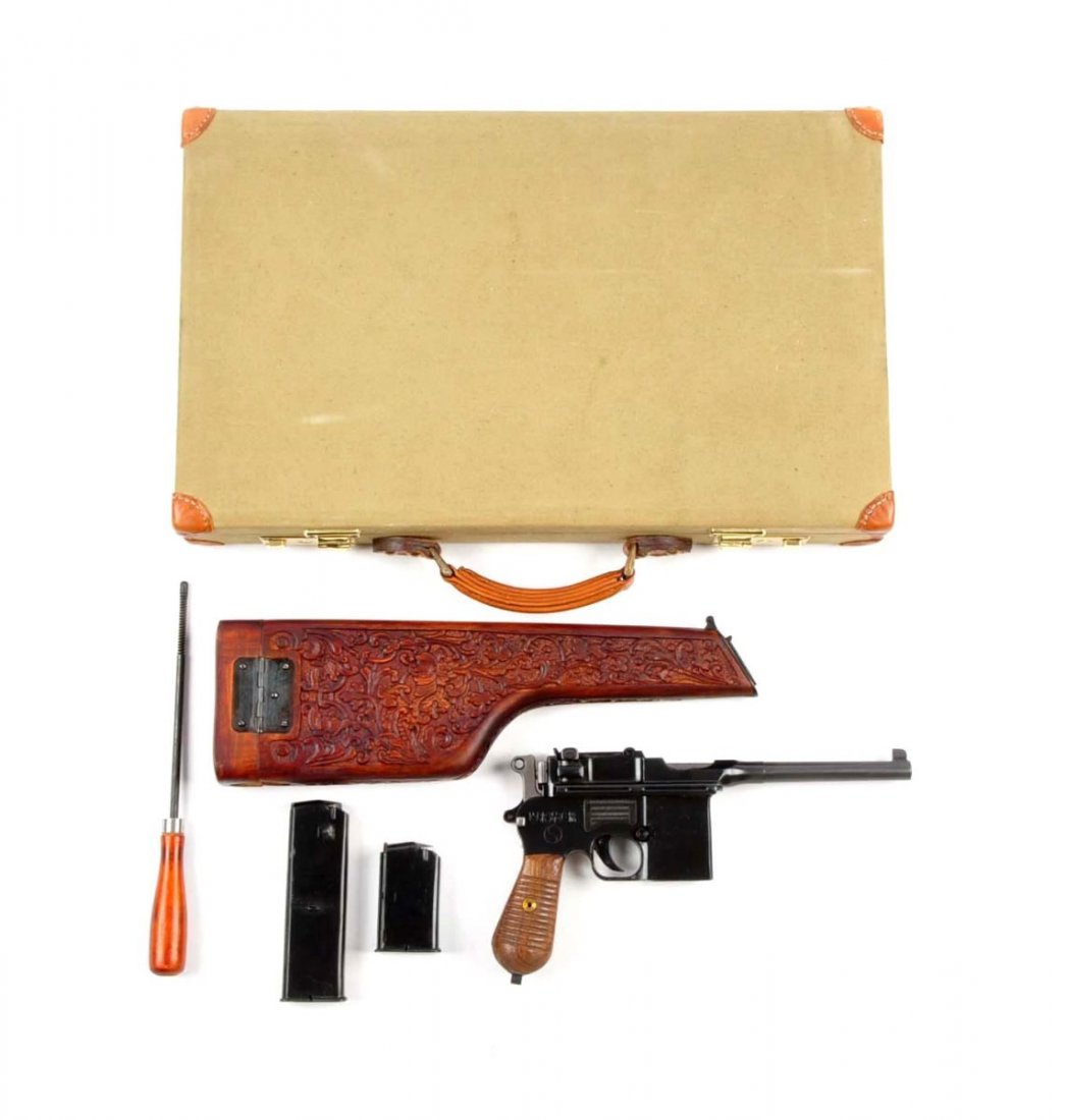 (C) Cased Chinese Broomhandle C-96 Removable Mag.: Serial # 5734 5" barrel in 9mm caliber. This is an early Chinese version of the Mauser Broomhandle Model C-96. Resembles any standard C-96 Model. Features the blued finish with the long range rear tan