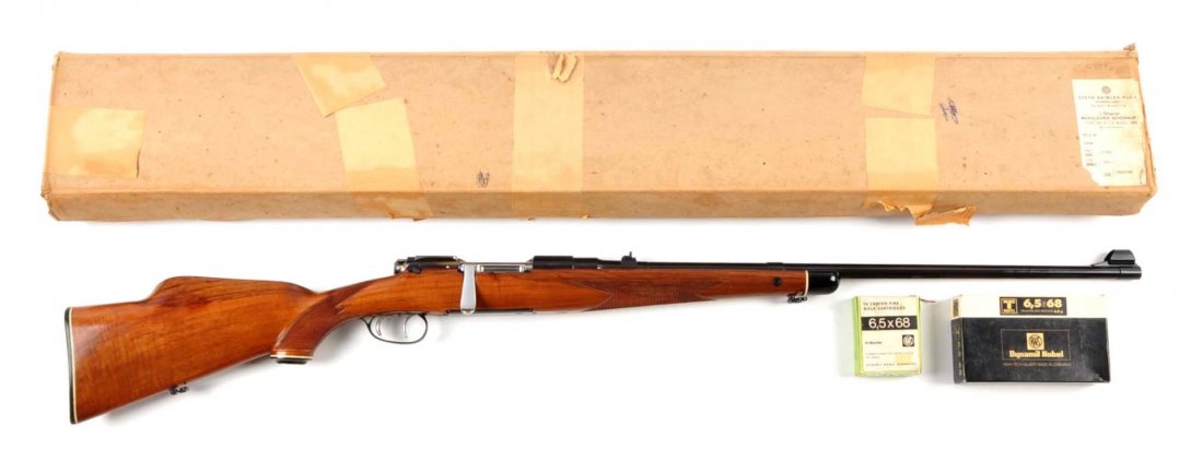 (C) N.I.B. Mannlicher Schoenauer Model MC Rifle.: Serial # 24434 26" barrel in 6.5x68mm caliber. Rifle features hooded ramp front sight, folding leaf rear sight, bridge not drilled, polished straight butter knife bolt handle, double set triggers, "St