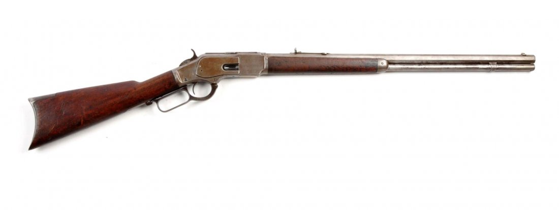 (A) Winchester Model 1873 Lever Action Rifle.: Serial # 365888B 24" barrel in .38-40 WCF. This standard rifle was manufactured in 1891. Features full octagon barrel, full magazine, sporting sights, walnut stock, and rifle butt. All metal surfaces 