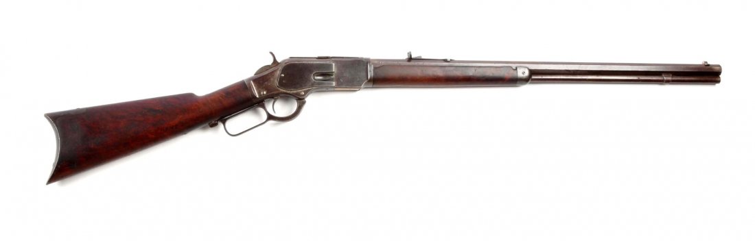 (A) Winchester Model 1873 Lever Action Rifle.: Serial # 167563A 24" barrel in .32-20 WCF. This standard rifle was manufactured in 1884. Features full octagon barrel, full magazine, sporting sights, walnut stock, rifle buttplate. All metal surfaces