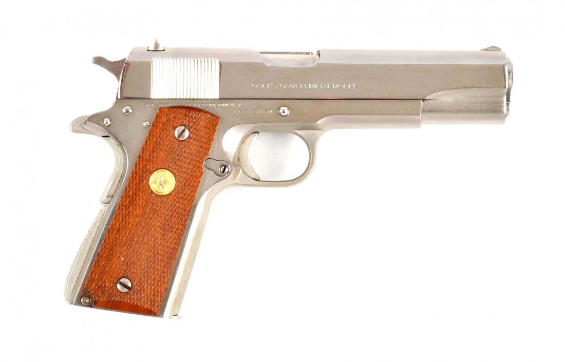 (M) Nickel Colt Series 70 Model 1911 A1 Pistol.: Serial # 16783B70 Cal. .45 ACP, barrel length 5". Manufactured in 1979. Features: High polish nickel finish on slide and frame with satin nickel finish on top of slide and frame lower, gold medal chec
