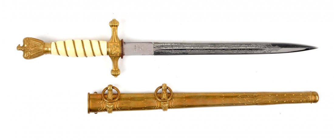 Nazi Kriegsmarine Dress Dagger.: Dagger has double fullers, spear point, etched blade, "WKC" marked. Blade measures 9-3/4". Has the gold plated handguard and pommel. Pommel has eagle with swastika. White broke grip with brass braid. 