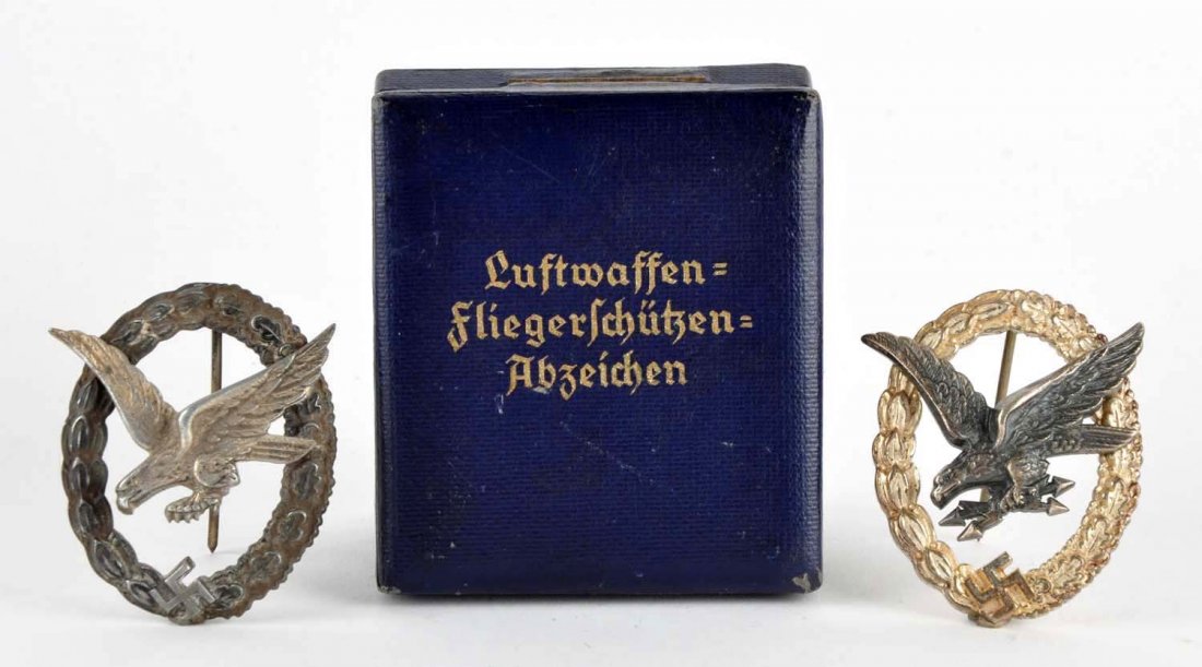 Lot of 2: Luftwaffe Badges.: First badge is in the original case, the outstretched eagle has lighting bolts in its talons, 2". The second badge is nearly identical but the eagle's talons are bare.